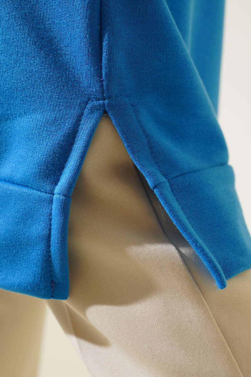 https://cdn.pazarium.com.tr/arma-detayli-uzun-tunik-indigo-442925-10-B.jpg