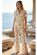 https://cdn.pazarium.com.tr/ayicikli-gomlek-yaka-muslin-kisa-kollu-pijama-takimi-bej-799942-19-B.jpg