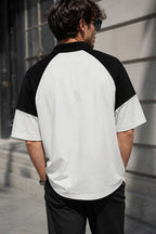 https://cdn.pazarium.com.tr/baskili-polo-yaka-oversize-erkek-t-shirt-beyaz-788523-19-B.jpg