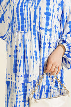 https://cdn.pazarium.com.tr/batik-desen-hakim-yaka-elbise-saks-798530-19-B.jpg