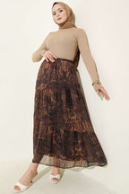 https://cdn.pazarium.com.tr/batik-desen-katli-sifon-etek-hardal-760626-18-B.jpg