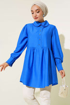 https://cdn.pazarium.com.tr/bebe-yaka-dantelli-tunik-saks-513458-12-B.jpg