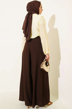 https://cdn.pazarium.com.tr/bel-ip-bagcikli-bol-paca-kadin-pantolon-kahve-809856-20-B.jpg