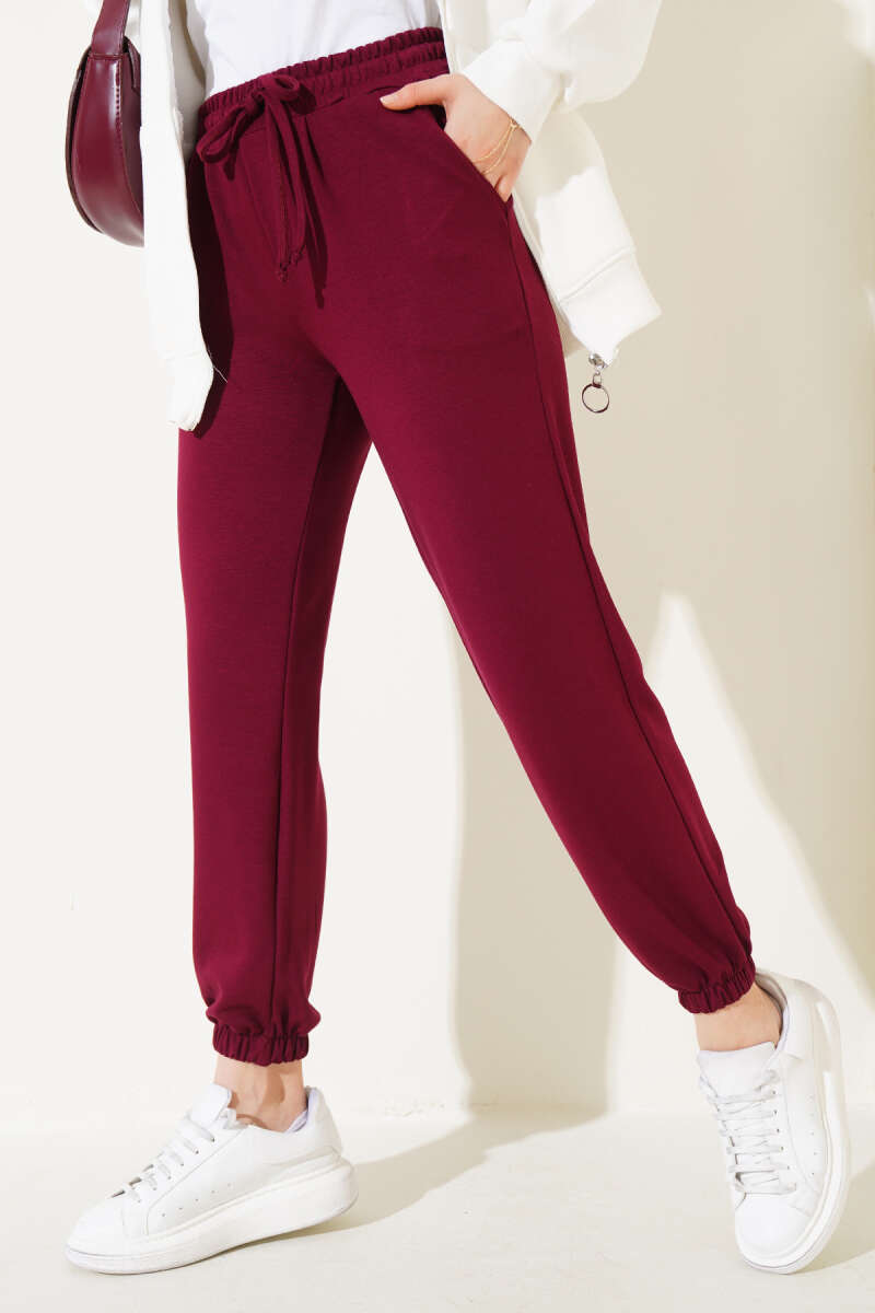 https://cdn.pazarium.com.tr/bel-ipli-paca-lastikli-jogger-pantolon-bordo-565514-13-B.jpg