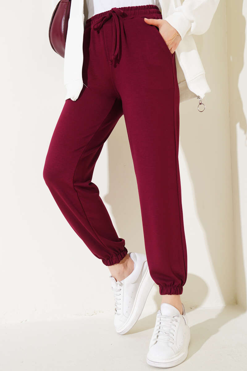 https://cdn.pazarium.com.tr/bel-ipli-paca-lastikli-jogger-pantolon-bordo-565515-13-B.jpg