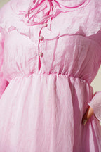https://cdn.pazarium.com.tr/bel-lastik-detayli-pelerinli-elbise-pembe-807828-19-B.jpg