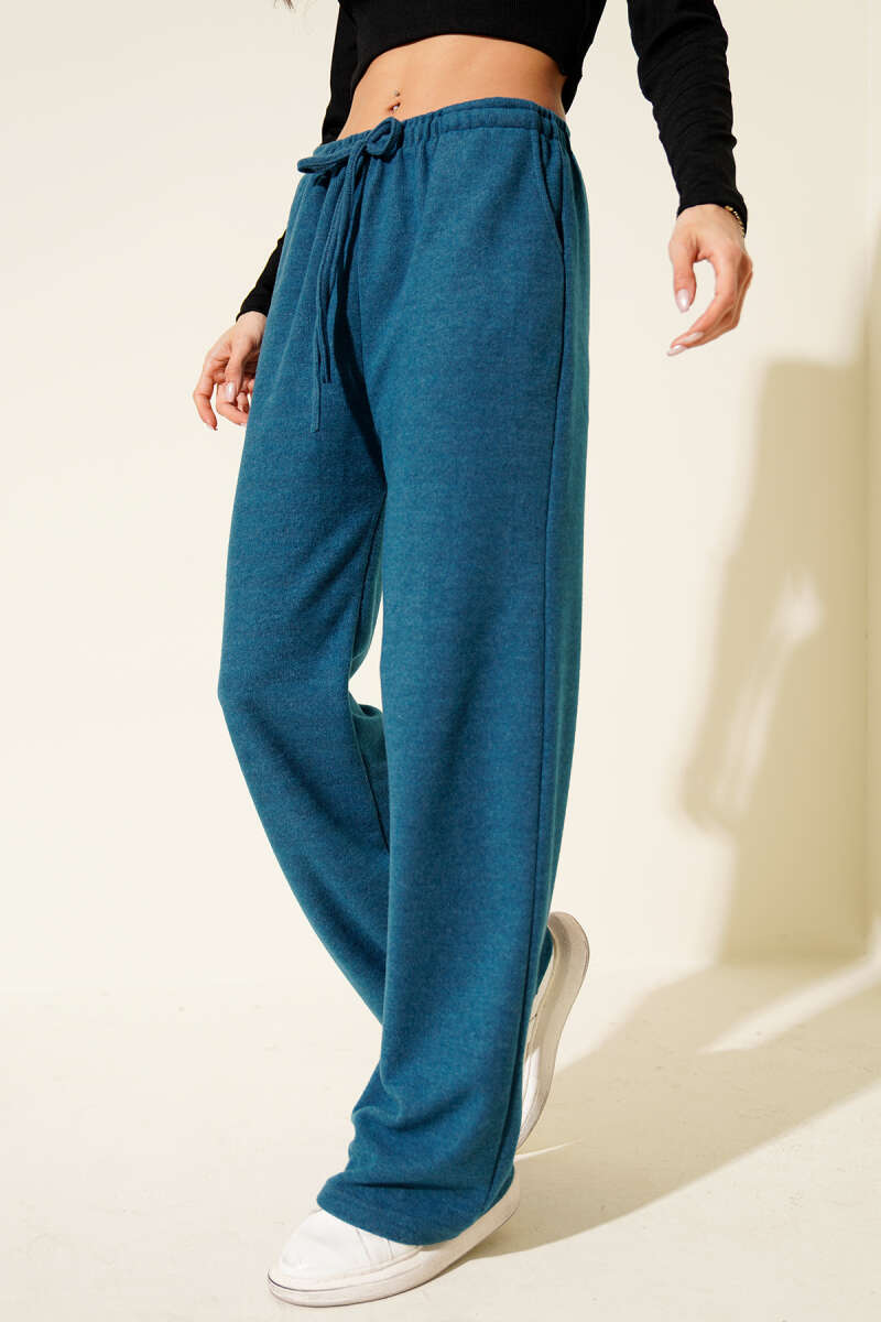 https://cdn.pazarium.com.tr/bel-lastikli-kase-pantolon-petrol-704093-17-B.jpg