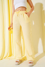https://cdn.pazarium.com.tr/bel-lastikli-muslin-pantolon-sari-651555-15-B.jpg
