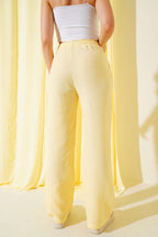 https://cdn.pazarium.com.tr/bel-lastikli-muslin-pantolon-sari-651556-15-B.jpg