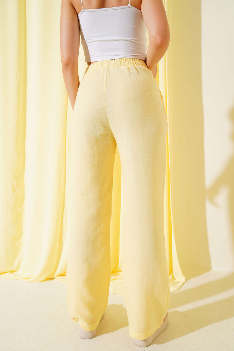https://cdn.pazarium.com.tr/bel-lastikli-muslin-pantolon-sari-651556-15-B.jpg