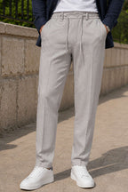 https://cdn.pazarium.com.tr/bel-lastikli-slim-fit-erkek-pantolon-gri-798339-19-B.jpg