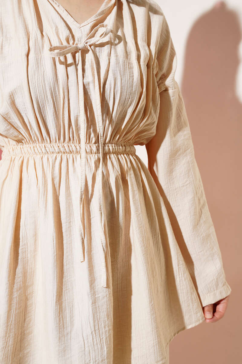 https://cdn.pazarium.com.tr/bel-lastikli-tunelli-ikili-takim-bej-630463-15-B.jpg