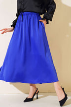 https://cdn.pazarium.com.tr/beli-buzgulu-piliseli-saten-etek-saks-452285-10-B.jpg