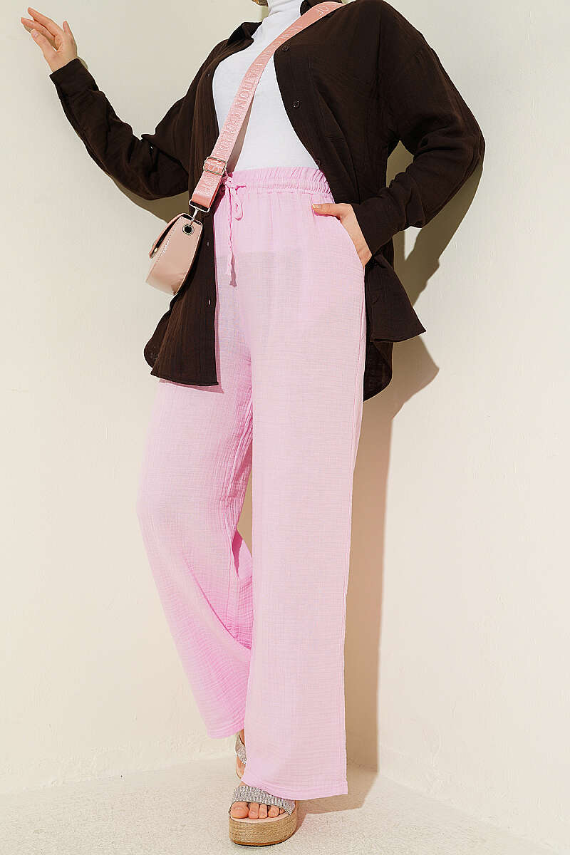 https://cdn.pazarium.com.tr/beli-lastikli-genis-paca-muslin-pantolon-pembe-778474-19-B.jpg