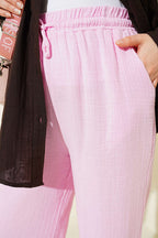 https://cdn.pazarium.com.tr/beli-lastikli-genis-paca-muslin-pantolon-pembe-778482-19-B.jpg