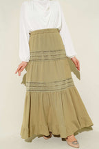 https://cdn.pazarium.com.tr/beli-lastikli-gupur-seritli-muslin-etek-cagla-yesili-745195-18-B.jpg