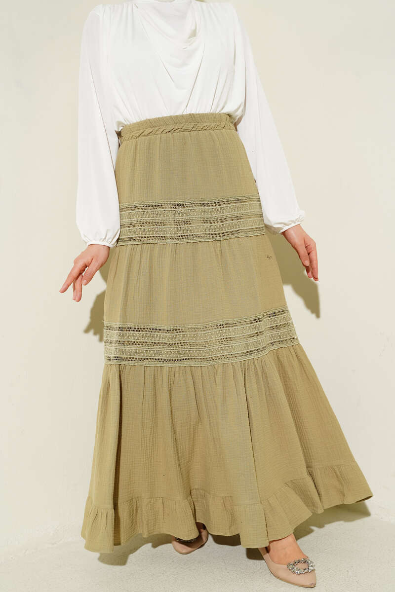 https://cdn.pazarium.com.tr/beli-lastikli-gupur-seritli-muslin-etek-cagla-yesili-745195-18-B.jpg