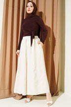 https://cdn.pazarium.com.tr/beli-lastikli-oversize-pacali-pantolon-bej-763879-18-B.jpg