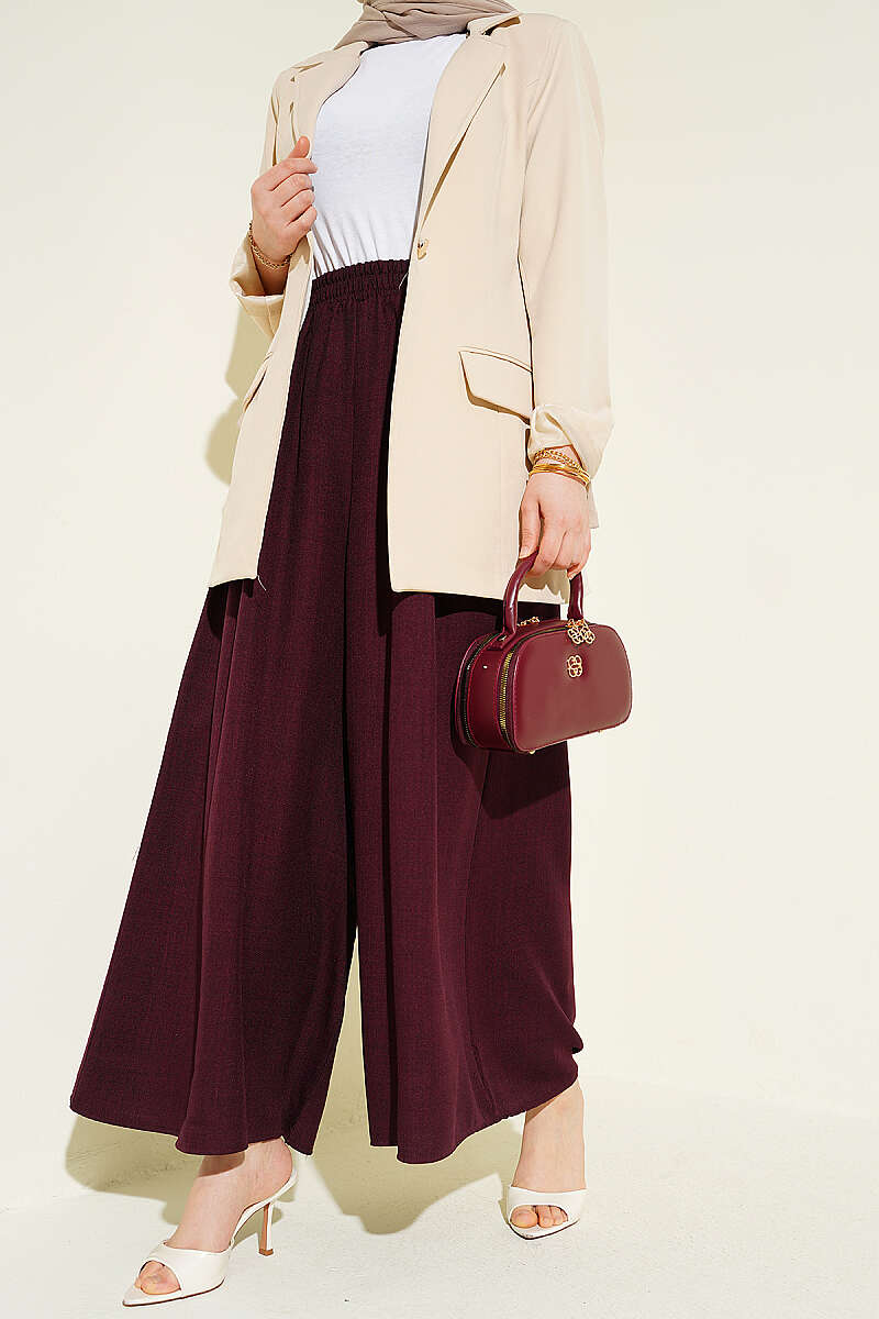 https://cdn.pazarium.com.tr/beli-lastikli-oversize-pacali-pantolon-bordo-763873-18-B.jpg