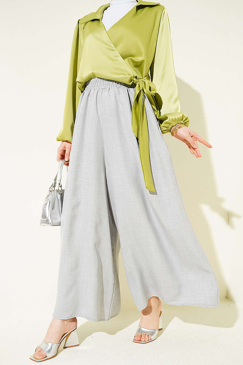 https://cdn.pazarium.com.tr/beli-lastikli-oversize-pacali-pantolon-gri-763775-18-B.jpg