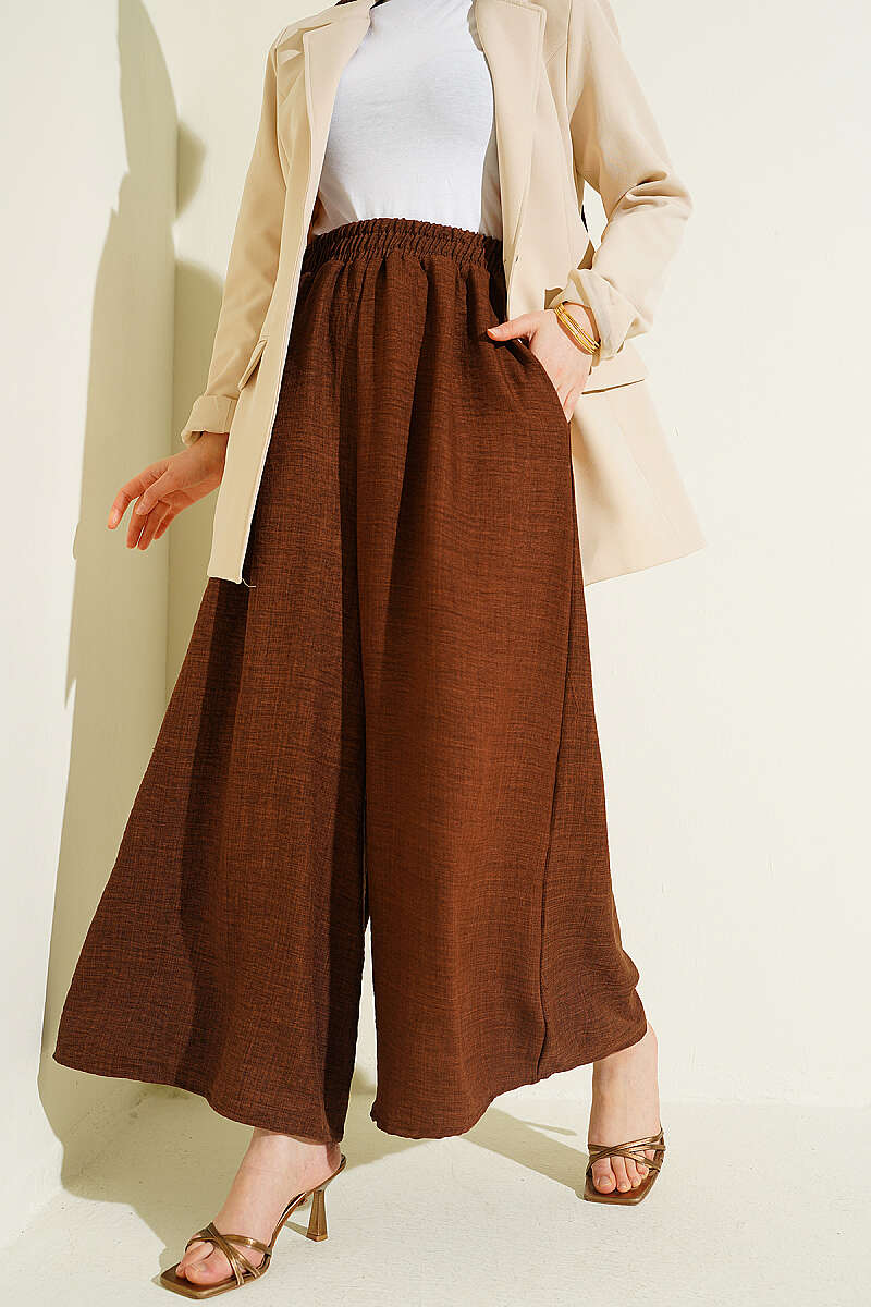 https://cdn.pazarium.com.tr/beli-lastikli-oversize-pacali-pantolon-kahve-763869-18-B.jpg