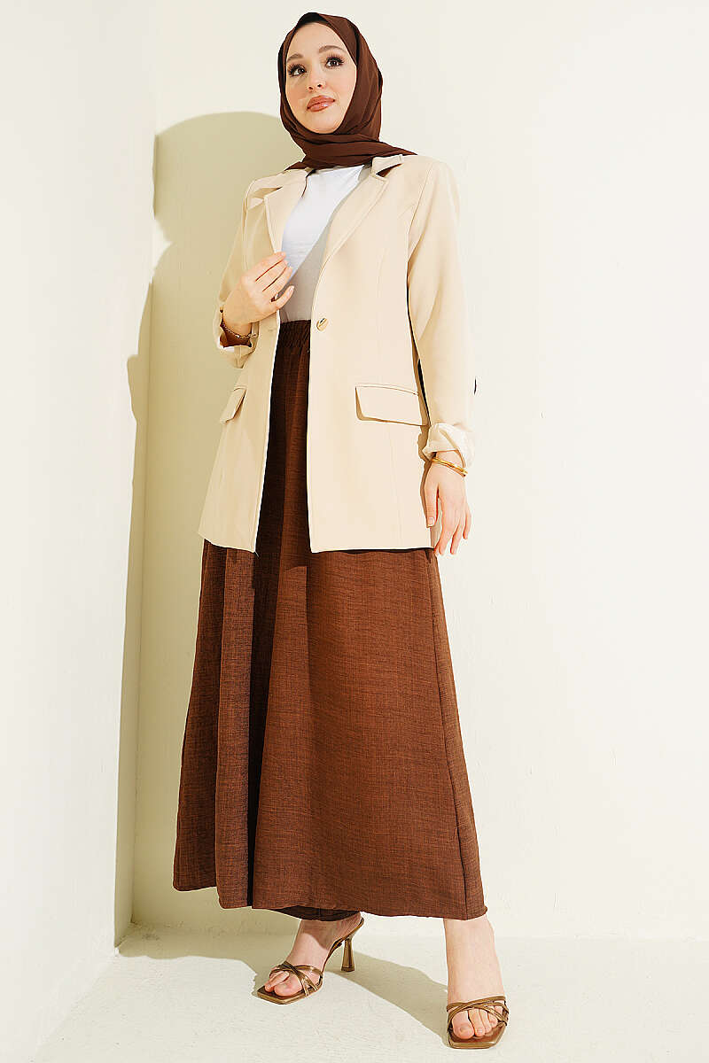https://cdn.pazarium.com.tr/beli-lastikli-oversize-pacali-pantolon-kahve-763871-18-B.jpg