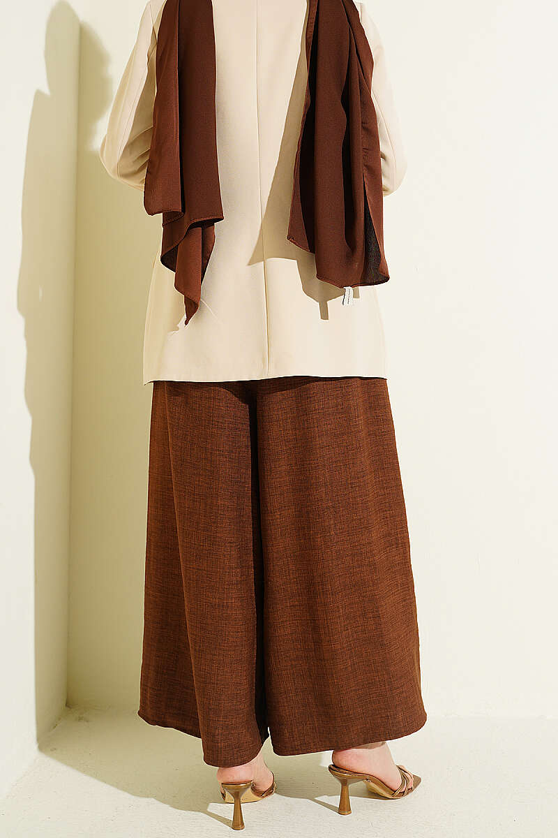 https://cdn.pazarium.com.tr/beli-lastikli-oversize-pacali-pantolon-kahve-763874-18-B.jpg
