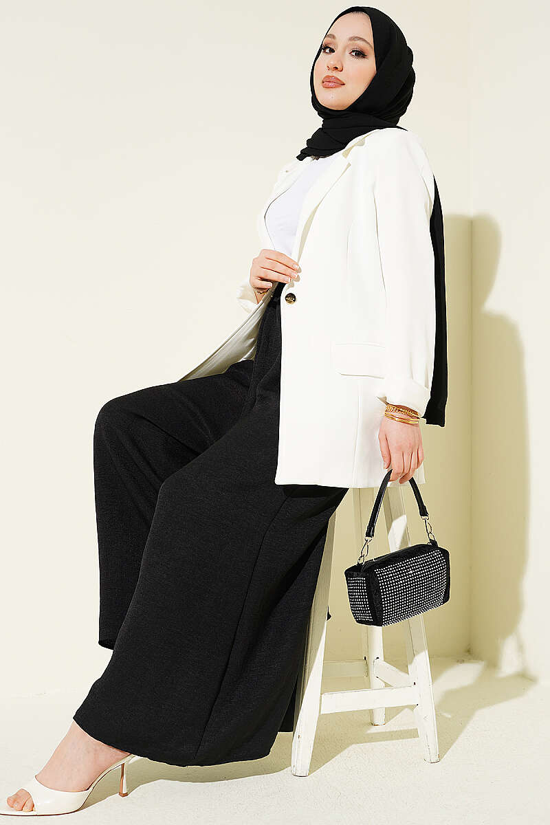 https://cdn.pazarium.com.tr/beli-lastikli-oversize-pacali-pantolon-siyah-763863-18-B.jpg