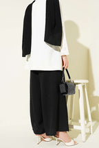 https://cdn.pazarium.com.tr/beli-lastikli-oversize-pacali-pantolon-siyah-763866-18-B.jpg