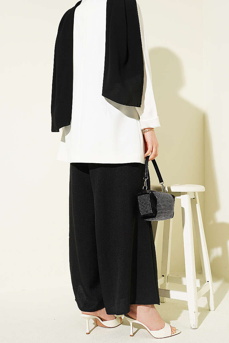https://cdn.pazarium.com.tr/beli-lastikli-oversize-pacali-pantolon-siyah-763866-18-B.jpg