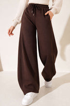 https://cdn.pazarium.com.tr/beli-lastikli-oversize-pantolon-kahve-842436-20-B.jpg
