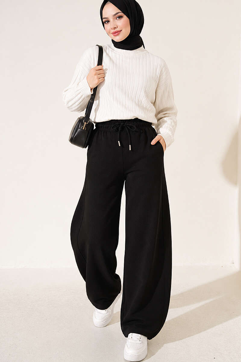 https://cdn.pazarium.com.tr/beli-lastikli-oversize-pantolon-siyah-842429-20-B.jpg