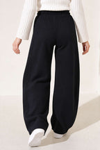 https://cdn.pazarium.com.tr/beli-lastikli-oversize-pantolon-siyah-842430-20-B.jpg