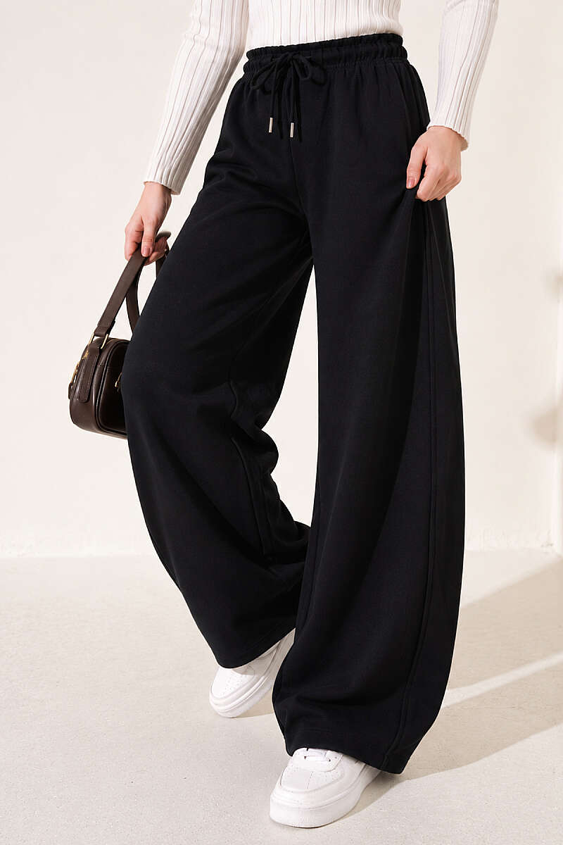https://cdn.pazarium.com.tr/beli-lastikli-oversize-pantolon-siyah-842431-20-B.jpg