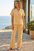 https://cdn.pazarium.com.tr/benekli-gomlek-yaka-muslin-kisa-kollu-pijama-takimi-oranj-799923-19-B.jpg