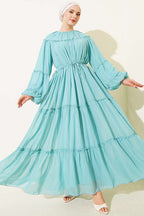 https://cdn.pazarium.com.tr/bilek-lastikli-kat-kat-sifon-elbise-mint-768822-18-B.jpg