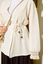 https://cdn.pazarium.com.tr/bilek-puskullu-keten-kimono-krem-799398-19-B.jpg