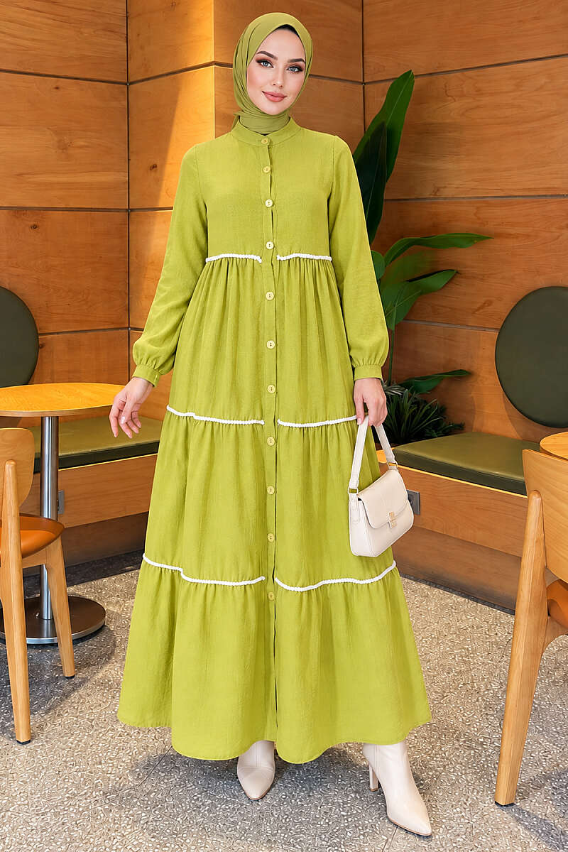 https://cdn.pazarium.com.tr/boydan-dugmeli-ponponlu-elbise-fistik-yesili-835414-20-B.jpg