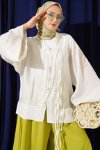 https://cdn.pazarium.com.tr/brit-dugmeli-oversize-kimono-tas-804573-19-B.jpg