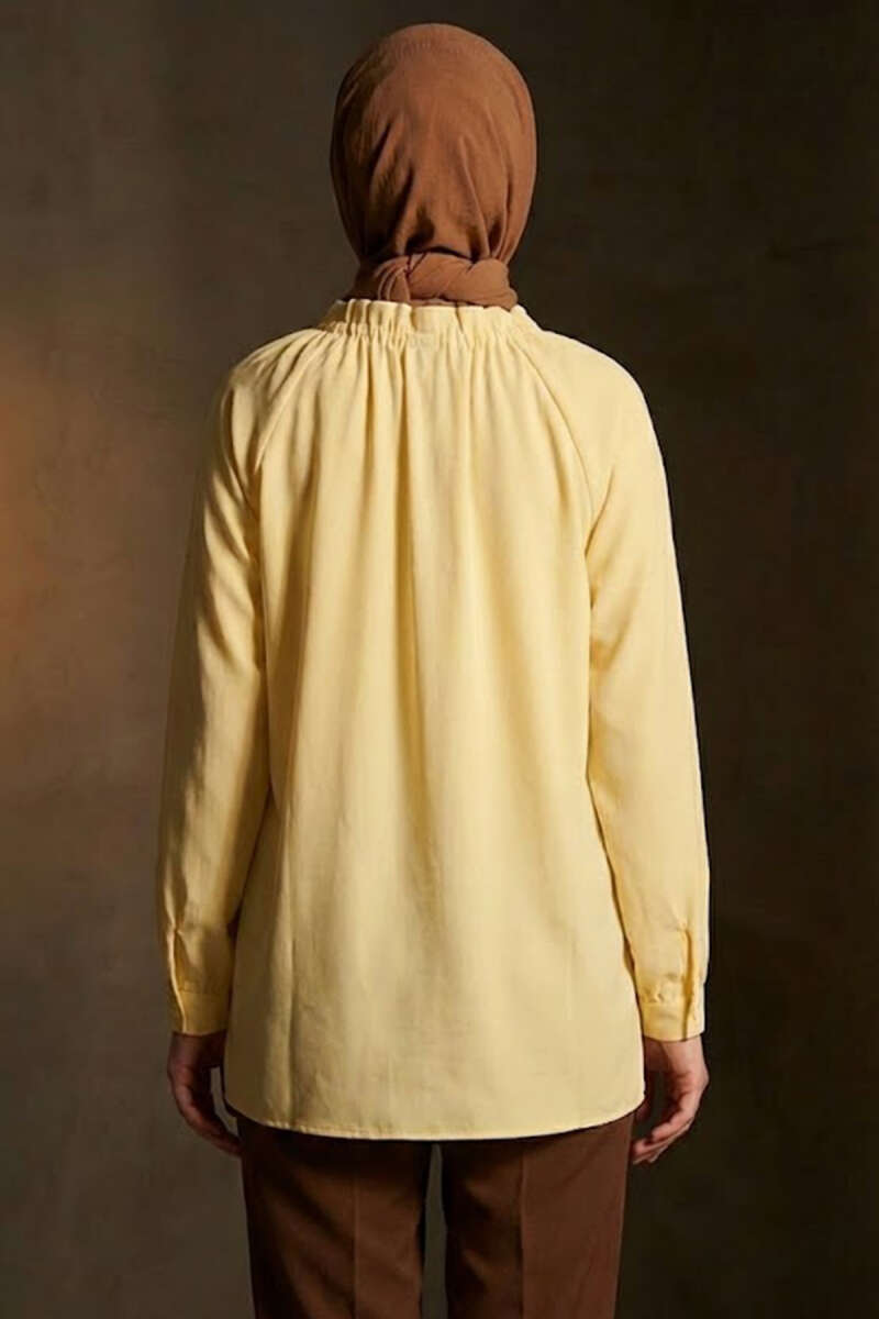 https://cdn.pazarium.com.tr/brit-dugmeli-yaka-bagcikli-tunik-sari-741853-18-B.jpg