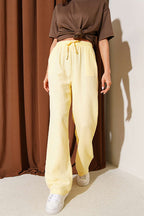 https://cdn.pazarium.com.tr/cepli-bel-lastikli-muslin-pantolon-sari-783572-19-B.jpg