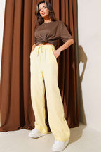 https://cdn.pazarium.com.tr/cepli-bel-lastikli-muslin-pantolon-sari-783576-19-B.jpg