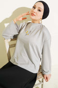 Blouse grise à motifs floraux pour l'allaitement