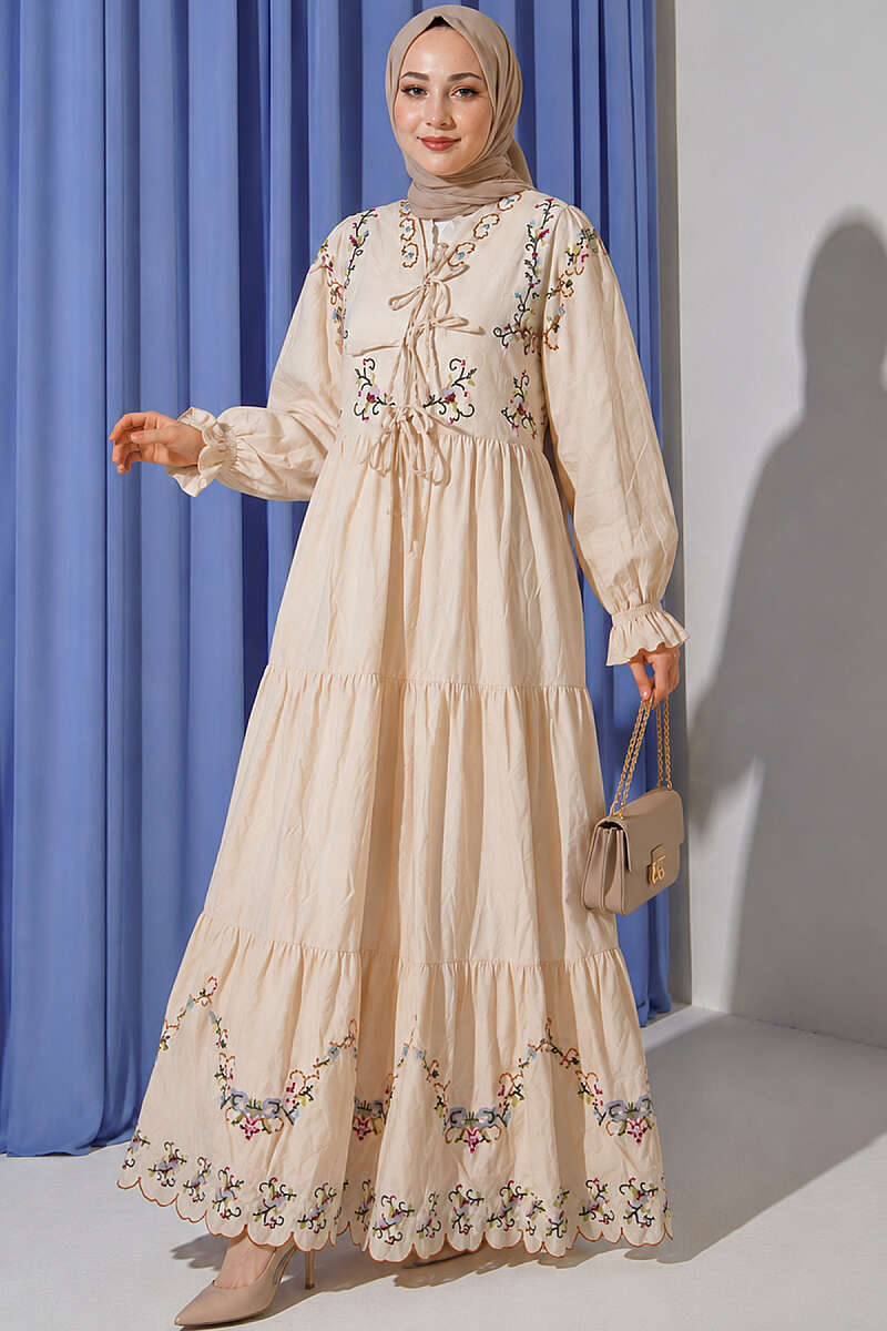 https://cdn.pazarium.com.tr/cicek-nakisli-bilek-lastikli-elbise-bej-806992-19-B.jpg