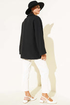 https://cdn.pazarium.com.tr/cizgi-kabartmali-onden-baglamali-kimono-siyah-644245-15-B.jpg