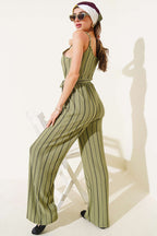 https://cdn.pazarium.com.tr/cizgili-burumcuk-ip-askili-tulum-cagla-yesili-635281-15-B.jpg
