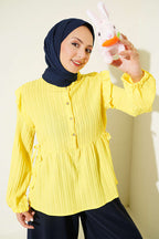https://cdn.pazarium.com.tr/dik-cizgili-omuz-firfirli-tunik-sari-811940-20-B.jpg