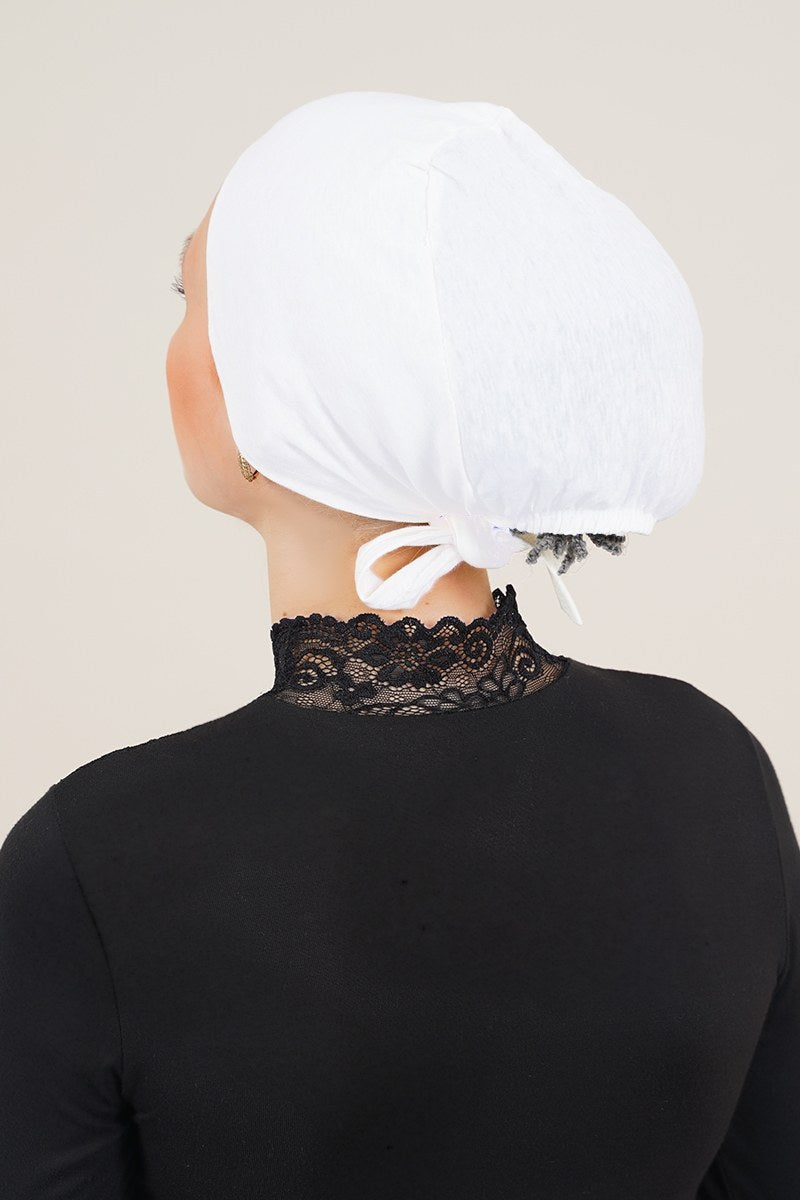 https://cdn.pazarium.com.tr/dikissiz-model-beyaz-bone-246617-42-B.jpg
