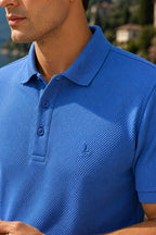 https://cdn.pazarium.com.tr/dugmeli-polo-yaka-waffle-erkek-t-shirt-indigo-791801-19-B.jpg