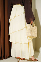 https://cdn.pazarium.com.tr/firfirli-bel-lastik-detayli-sifon-etek-sari-808484-20-B.jpg